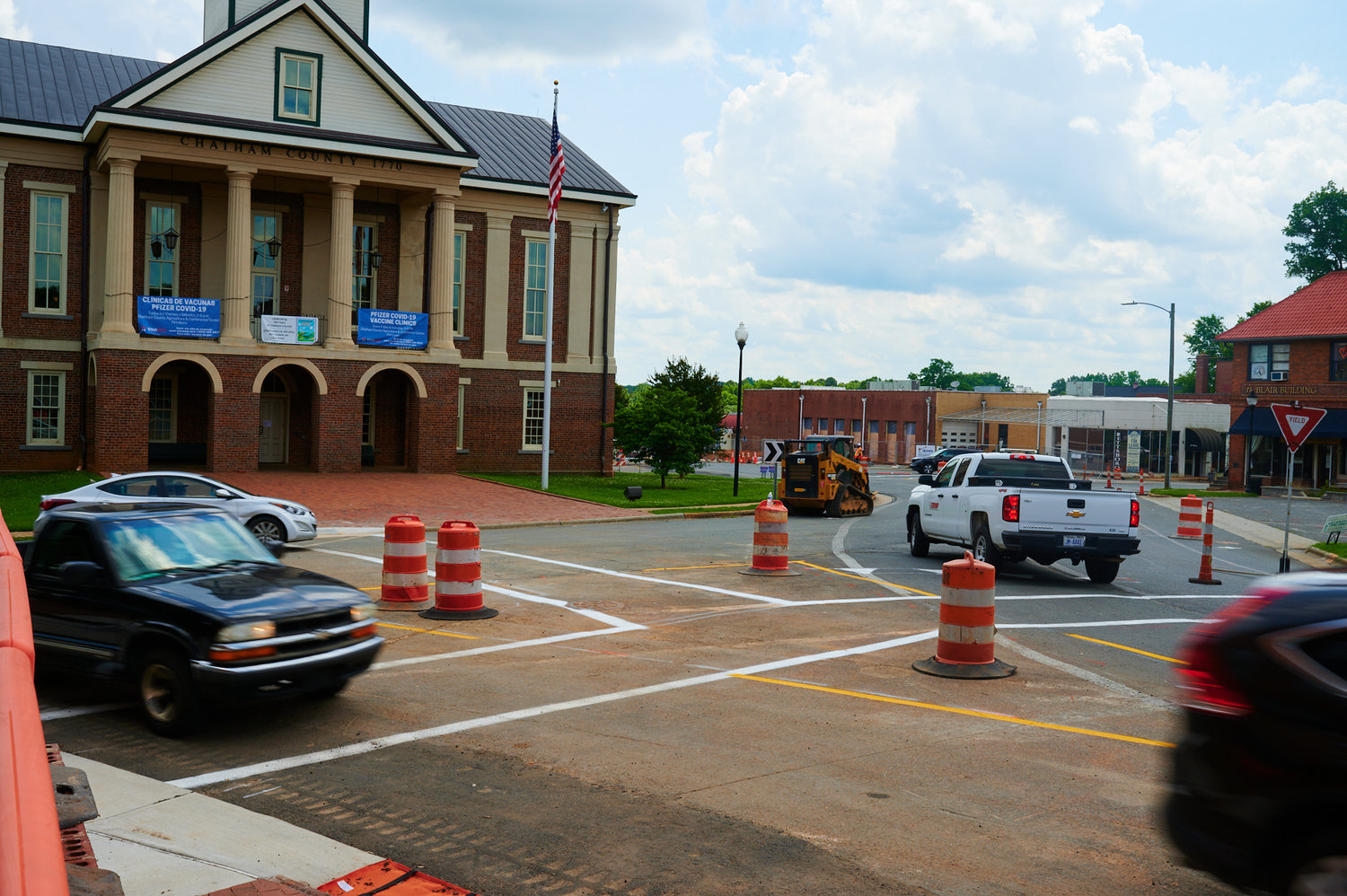 Pittsboro's traffic circle re-opened for traffic Monday, but work on the $2.48 million project continues.